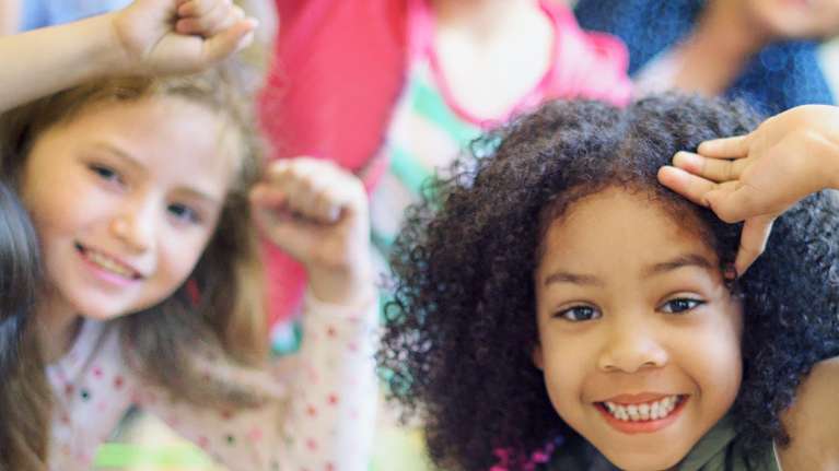 Smiling children in Brisbane learning healthy habits supported by oral myofunctional therapy at Be W