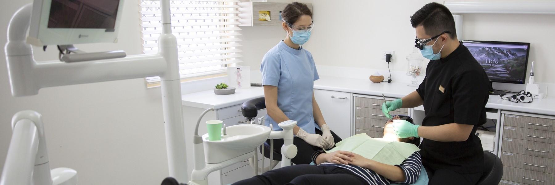 dentist performing periodontal treatment in highgate hill
